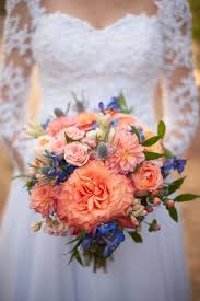 Soft peach and light ice blue is such a beautiful color combination, it will make every part of the wedding day so comfortable, bridesmaids in ice blue, bouquets of blue and peach flowers, ice blue tablecloths, peach flower centerpieces with blue accent, ice blue and peach chair decorations… Pin On Wedding Party