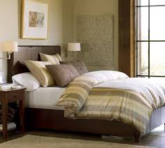 Love the legs on this bed. Jameson Leather Bed Headboard Pottery Barn