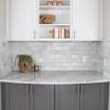 Light gray kitchen cabinets white backsplash tiles. 1