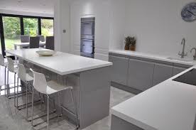 Our Clients Viseu Handleless Grey White High Gloss Kitchen With White Corian Worktops And White Gloss Kitchen Grey Gloss Kitchen Grey Kitchens
