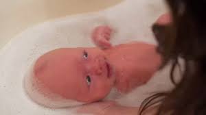 Hold your baby on your lap while sitting in a chair with your bath kit on an adjacent table, or stand up at the counter with baby lying on a pad of thick towels. 1 Month Baby Stock Footage Royalty Free Stock Videos Pond5