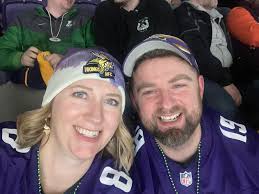 What shirt is mom wearing at the Vikings game?