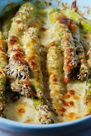 Impressive Easter Sides From Caprese Asparagus To Herbed Potatoes Cheesy Baked Asparagus Recipe Asparagus Recipe Baked Asparagus