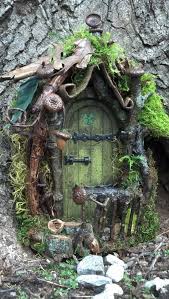 Fairy doors fairy garden door that opens mushroom design with cat and squirrel. 5 Of Our Favorite Fairy Doors That Are Rustic Made From Natural Elements Fairy Houses Fairy Garden Houses Fairy Garden Diy