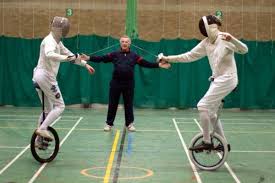 Unicycle Fencing Bout Unicycle Fence Fencing Sport