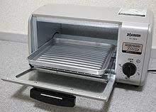 Chopped the cord off the old one, mailed it back and set the now cordless toaster oven in the garage to take for recycling. Oven Wikipedia