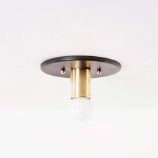The holly ceiling light fixture is constructed from solid brass and hand paddled art glass. Contemporary Ceiling Light Louis Atelier De Troupe Tubular Steel Brass