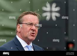 Rheinbach, Germany. 31st July, 2023. Boris Pistorius (SPD, r), Federal  Minister of Defense, stands next to the CIR Inspector, Vice Admiral Thomas  Daum, during his inaugural visit to the military organizational unit (