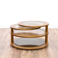 This Round Swivel Coffee Table Is Featured In A Solid Wood With A Glossy Oak Finish This Unique Retro Ta Coffee Table Coffee Table Wood Coffee Table Structube