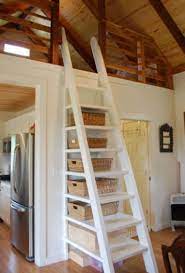 Woman Downsizes To 557 Sq Ft Tiny Cottage Tiny Cottage Tiny House Living Bedroom Loft