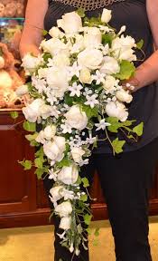A fabulous, eye catching cascading bouquet with a blush pink king protea, white and pink roses, queen anne's (above) rustic fall cascade wedding bouquet: Laura Cascade Bouquet White Wedding Flowers Cascading Wedding Bouquets Rose Wedding Bouquet