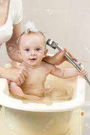 A baby shower is traditionally held during the expectant mother's last trimester, but that rule isn't hard and fast. Cheerful Baby Boy Having Bath And Playing With Shower Head Stock Photo Picture And Royalty Free Image Image 81281883