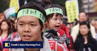 Beijing official sets anti-independence limits for Hong Kong as thousands  march against government push to disqualify lawmakers