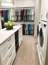 Hallways are typically centrally located in homes and link bedrooms together, making them ideal for laundry. So Fresh And So Clean Master Closet With Island And Laundry Transitional Closet Other By Cabinet Concepts By Design Houzz