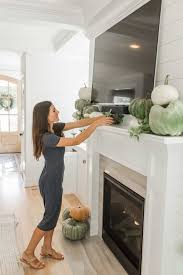You can really make a mantel look great by adding low decor under the tv and anchoring the sides with larger, taller decor. Mantel Decor With A Tv 6 Ways To Pull It Off Chrissy Marie Blog