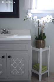 Give your bathroom cabinets a makeover quickly and easily with this tutorial! Before After My Pretty Painted Bathroom Vanity