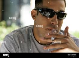 Eddie Silva, a staff sergeant select with the U.S. Marines, sits outside  and smokes a cigarette at the VA Western Blind Rehabilitation Center in  Palo Alto, Calif., Wednesday, Oct. 8, 2008. Silva