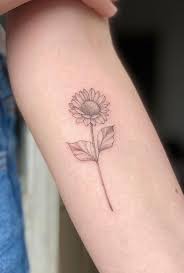This is an alluring woman with a black and white sleeve tattoo. 50 Small Sunflower Tattoo Ideas
