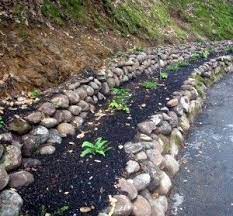 Low Retaining Walls Can Help Prevent Erosion Sloped Garden Landscaping Austin Hillside Landscaping