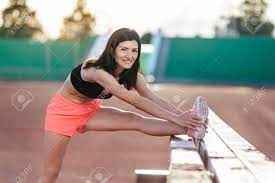 Outdoor stretch (all 7 results). Beautiful Brunette Runner Woman Doing Stretching Leaning Her Stock Photo Picture And Royalty Free Image Image 131826853