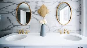 Rustic wooden shelves add open storage solutions, and a simple, geometric pattern adds texture. Small Bathroom Ideas To Take Your Space From Grimy To Great Grazia