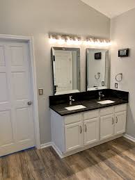 The kitchen is small but gets lots of light and it's open. Bathroom Vanity Update White Cabinets Black Granite Black Granite Countertops Light Grey Walls