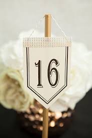 Check Out These Unique Diy Hanging Table Number Stands With Free Printable Numbers Diy Table Numbers Diy Wedding Table Table Number Stands