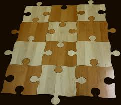 Jigsaw puzzles can be made so creatively because each piece is different yet they all fit i've been a lot of these types of floors with many different colors mixed into the design. Puzzle Floor Hardwood Puzzle Floor