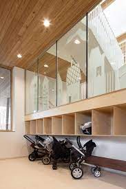 carseat and stroller parking second story railing catwalk daycare design kindergarten interior kids daycare