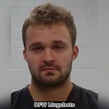 A man has been taken into custody for murder after allegedly shooting and  killing another man in front of the victim's 7-year-old son during a  dispute outside a Fort Worth apartment complex.