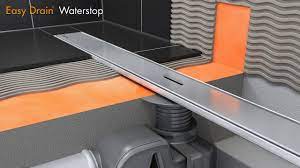 This durable walk in shower is equipped with plywood backing, grabs bars and a shower seat to ensure your safety and comfort. Linear Shower Drain Installation Easy Drain Waterstop English Youtube