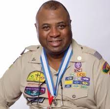 Helping younger youth at the campout with P300