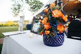 It reminds me of all bright things, and screaming for attention. Orange And Navy Blue Reception Flower Arrangements