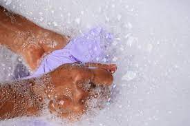 Try under or near the care label since this part of the towel is usually out of sight when the towel is hung over a towel bar. Woman S Hands Washing White Color Clothes In The Basin Stock Photo Image Of People Dirty 119000574