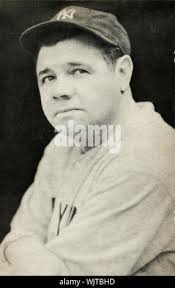 Yankees' baseball legend Babe Ruth, accompanied by his wife Claire, second  from right, daughter Julia, left, and friend Isabel Miles, is bundled up  against the cold as they attend the Army-Navy football