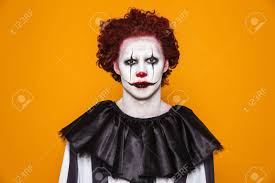 Ever wonder why we all suddenly get dressed up in crazy costumes and prowl the streets in search of candy every october 31? Sad Clown Man 20s Wearing Black Costume And Halloween Makeup Looking At Camera Isolated Over Yellow Background Stock Photo Picture And Royalty Free Image Image 112483557