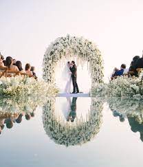 People arriving on the beach, full wedding coverage, group formal photos, bride & groom walking on the beach after the wedding, fun photos and portraits. Glam Phuket Wedding With Stunning Mirror Walkway Ruffled