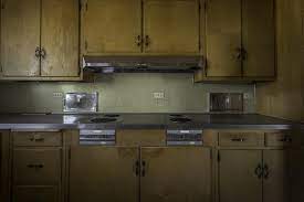 So instead of building brand new doors, or having them custom made, just flip the existing door over and add trim to create the shaker look. How To Make Old Cabinets Look Modern Old Cabinets Cabinet Old Cabinet Doors