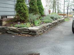 You can make your home and property more attractive easily with driveway landscaping. Custom Landscape Design Along Driveway Millenium Stoneworks