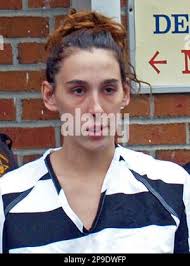 ADVANCE FOR MONDAY NOV. 8 AND AFTER** In an Oct. 28, 2010 photo, Michelle  Berkley stands near a house that appears to be abandoned that is across the  street from her home