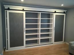 Remember this can be dangerous Storage Cabinet With Sliding Barn Doors Modern Wardrobe Los Angeles By Upstairs Downstairs Furniture Houzz