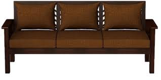 Brown sofa with green cushions standing in white open space living room interior with wooden table on carpet, grey. Wooden Sofa Sets