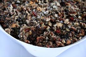When the butter begins to foam, stir the onion into the butter and cook until the onions are soft and golden, 5 to 7 minutes. The Bitten Word Thanksgiving 2010 Wild Rice Dressing With Dried Fruits And Nuts