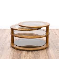 Place piece of glass on top of the ledger, so the rocks are below. This Round Swivel Coffee Table Is Featured In A Solid Wood With A Glossy Oak Finish This Unique Retro Table Has 4 Round Glass Top Tiers And 2 Swinging Swivel T