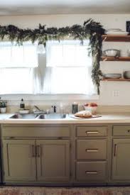 It seems that the crown moulding is just. Christmas Kitchen Window Garland The Little By Little Home