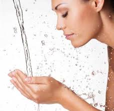 Image result for woman putting water on her face