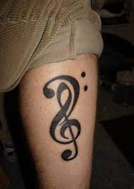 The treble clef is sometimes referred to as the g clef because of it's shape. Tatto Wallpapers Treble And Bass Clef Tattoo
