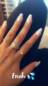 Give your matte black nails an artistic twist with the addition of white shapes painted on. Soft White Coffin Nails Acrylicnails White Acrylic Nails White Coffin Nails Short Coffin Nails