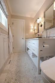 There is a partition with patterned blue glass marking a divide between the. Narrow Bathroom Design Ideas