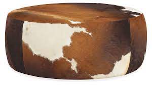 You'll use it as an extra seat, footrest, or even casual coffee table. Lind Cowhide Round Ottomans Modern Ottomans Footstools Modern Living Room Furniture Room Board